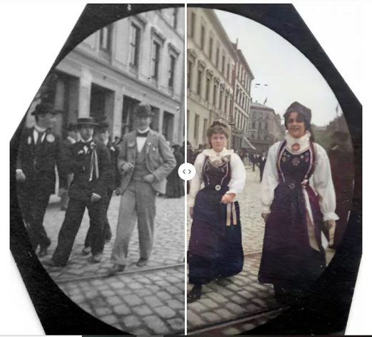 Ihmisiä kadulla, muun muassa kaksi norjalaiseen perinteiseen asuun pukeutunutta naista. Toinen hymyilee epävarmasti kameralle